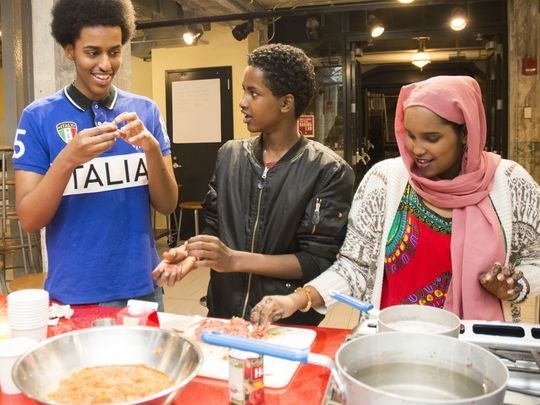 “Soo Fariista/Come Sit Down: A Somali American Cookbook” features traditional Somali family recipes with a modern Minnesota twist. The cookbook was authored by Somali high school students who participated in the Minnesota Historical Society program “Wariyaa: Somali Youth in Museums” in 2016. Students interviewed family members, collected recipes and stories, researched techniques and ingredients and tested recipes at the Mill City Museum Baking Lab. The "Somalis + Minnesota" exhibit opens June 23, 2018 at the Minnesota History Center. (Photo: Andrea Reed, Minnesota Historical Society)